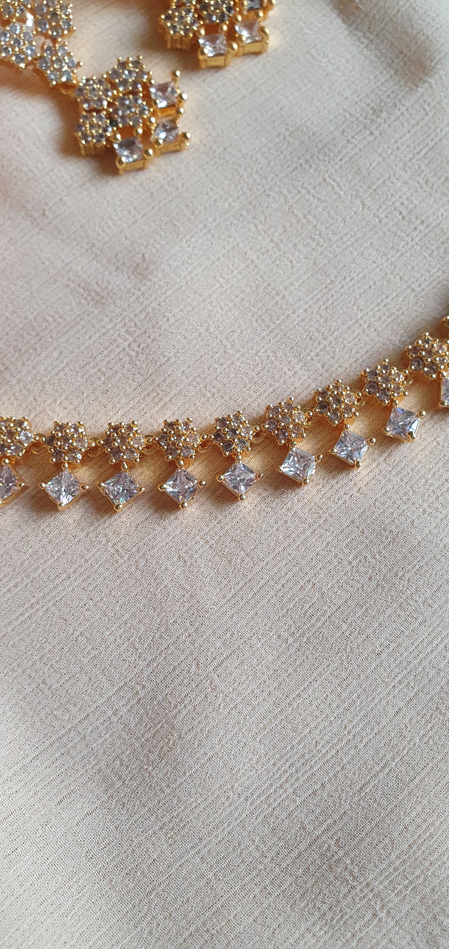 GOLD A.D. STONE SET IN WHITE