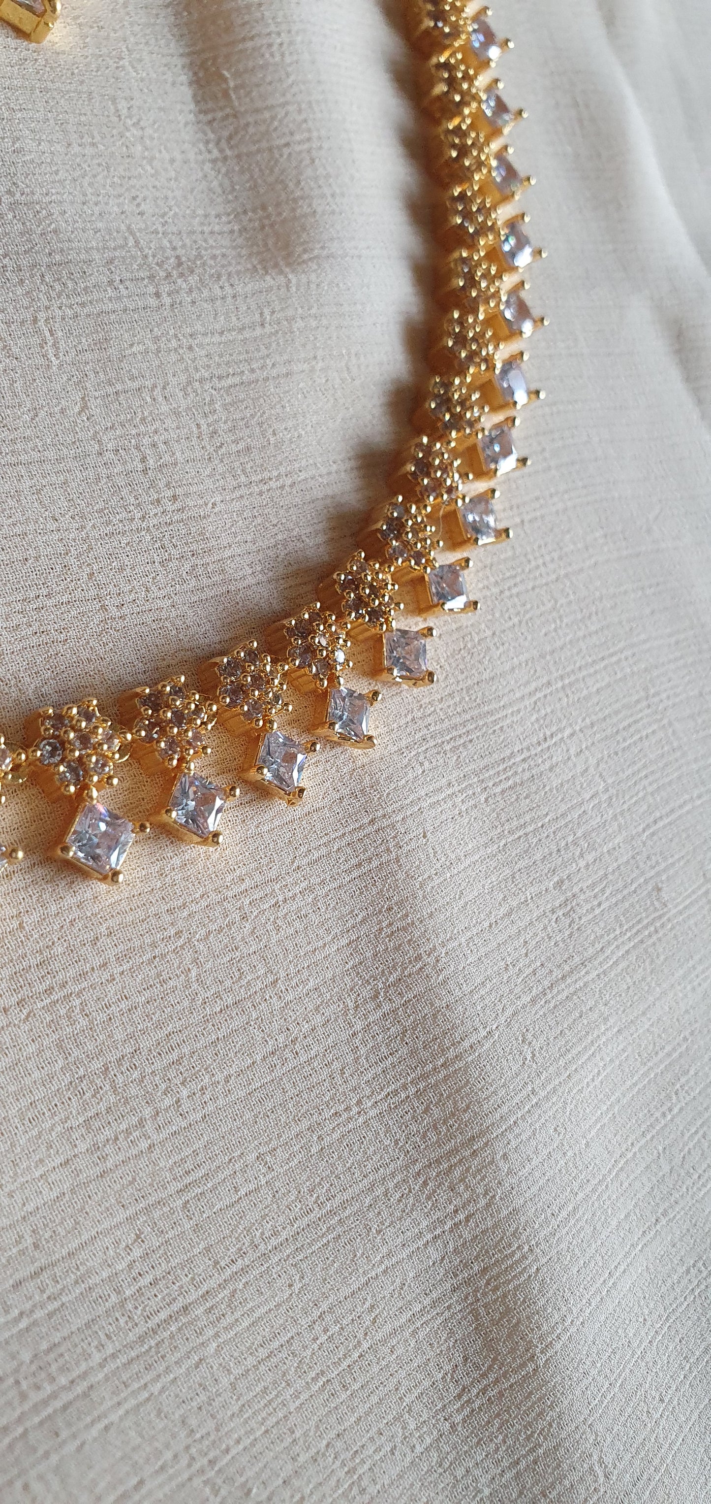 GOLD A.D. STONE SET IN WHITE