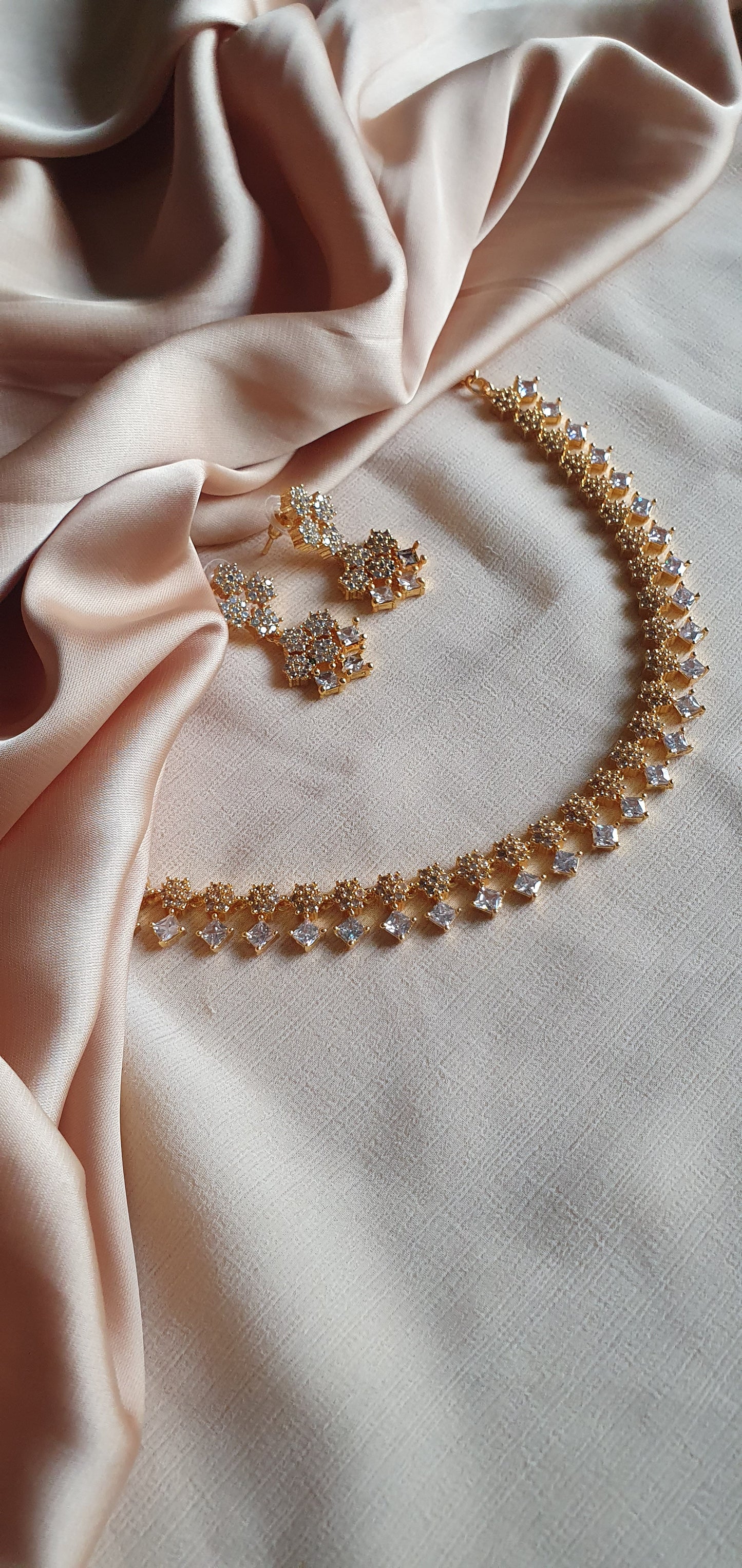 GOLD A.D. STONE SET IN WHITE