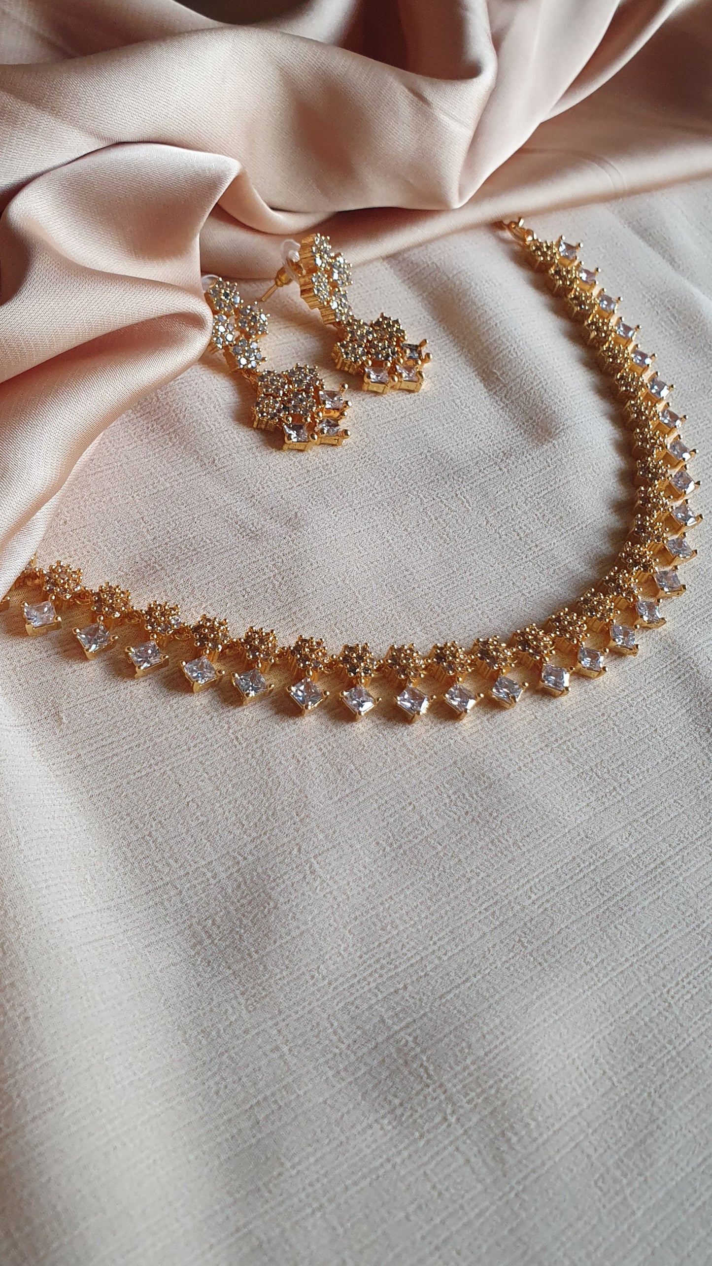 GOLD A.D. STONE SET IN WHITE