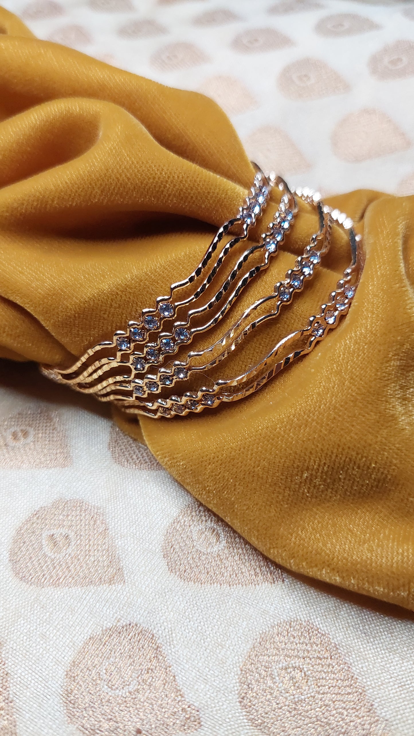 SET OF 4 GOLD BANGLES