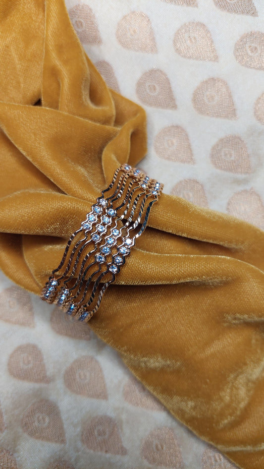 SET OF 4 GOLD BANGLES